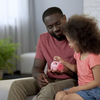 Purchased - A father teaching his daughter about finances